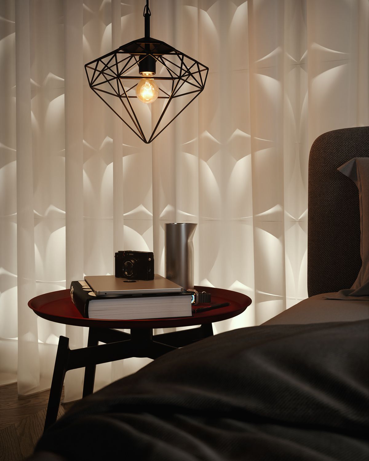 A render of a bedroom corner at night: a faceted black wire pendant over a red topped side table holding a camera, a laptop, a thick book and a metal vessel, a sheer curtain drawn across a sculpted wall panel behind, and the corner of a bed with a dark throw.