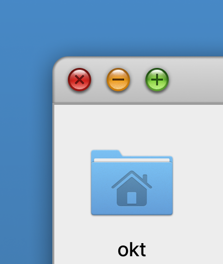 A close view of the top left corner of the same window: three round controls in red, amber and green set into a grey title bar, and below them a blue home folder icon labelled okt.