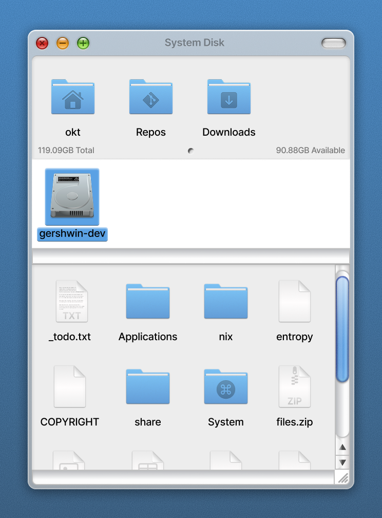 A screenshot of a file browser window titled System Disk on a blue desktop. A shelf across the top holds three blue folders labelled okt, Repos and Downloads, with a capacity line reading 119.09GB total and 90.88GB available. Below it a hard disk icon labelled gershwin-dev sits selected, and under that a scrolling list of items including _todo.txt, Applications, nix, entropy, COPYRIGHT, share, System and files.zip.